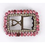 A Georgian paste set buckle bordered by pink pear shaped stones,