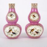 A pair of Meissen pink ground double gourd vases painted reserves of birds,