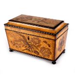 A late Georgian marquetry inlaid tea caddy, the cover and sides with floral inlays,