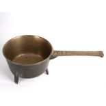 An 18th Century bell metal skillet on three feet, the handle marked Y4,