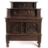 An oak court cupboard constructed from 17th Century and later carved wood,