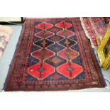 An Eastern rug decorated triple pole medallions,