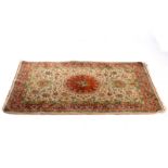 A Kashan rug with floral design on a camel coloured ground CONDITION REPORT: Lot
