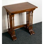A nest of three mahogany tables on turned supports with bowed front stretcher,