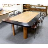 An early 20th Century oak dining table, by Bowman Brothers, with Art Deco style curved legs,