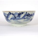 A Chinese porcelain blue and white punch bowl, circa 1760, painted with a continuous landscape,