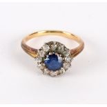 A sapphire and diamond cluster ring, in a galleried setting to an unhallmarked yellow metal shank,