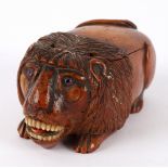 A coquilla nut lion snuff box, circa 1800, realistically carved with bone, teeth and tongue,