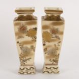 A pair of Japanese square tapering section bottle vases, painted with priests and flowers, signed,