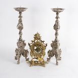 A pair of silvered pricket candlesticks of Carolean design,