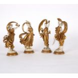 A set of four porcelain figures of dancing Classical nymphs, white and gold,