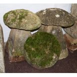 Two staddle stones with bases and a spare tops