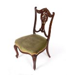 An Edwardian salon chair with upholstered seat,