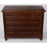 A fruitwood chest of James II style, fitted four drawers on turned feet,