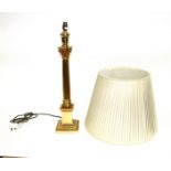 A brass Corinthian column lamp and shade,