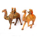 A carved wooden camel with ceremonial harness,