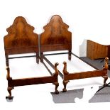 A pair of walnut single bed ends,