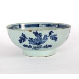 An English Delftware blue and white bowl, circa 1760, painted with a bird in a shrub, 22.