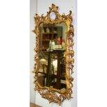 A Rococo style giltwood and gesso wall mirror,