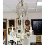 An Osler style cut glass three-light chandelier with scroll and foliate crown,