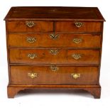 An 18th Century walnut and crossbanded chest of two short over three long drawers,