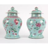 A pair of 20th Century Chinese vases painted chrysanthemums on a turquoise ground,