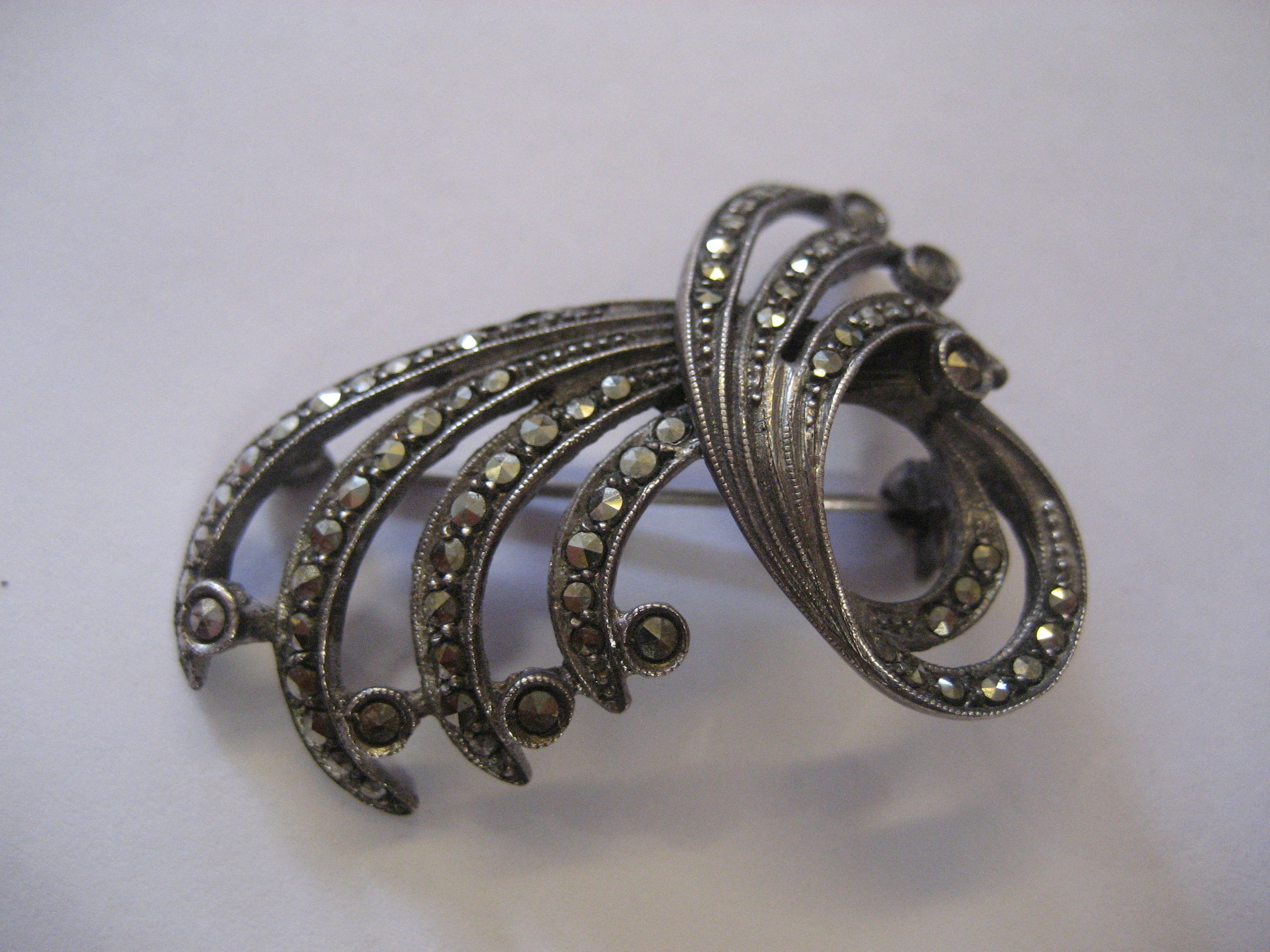 A silver marcasite brooch.