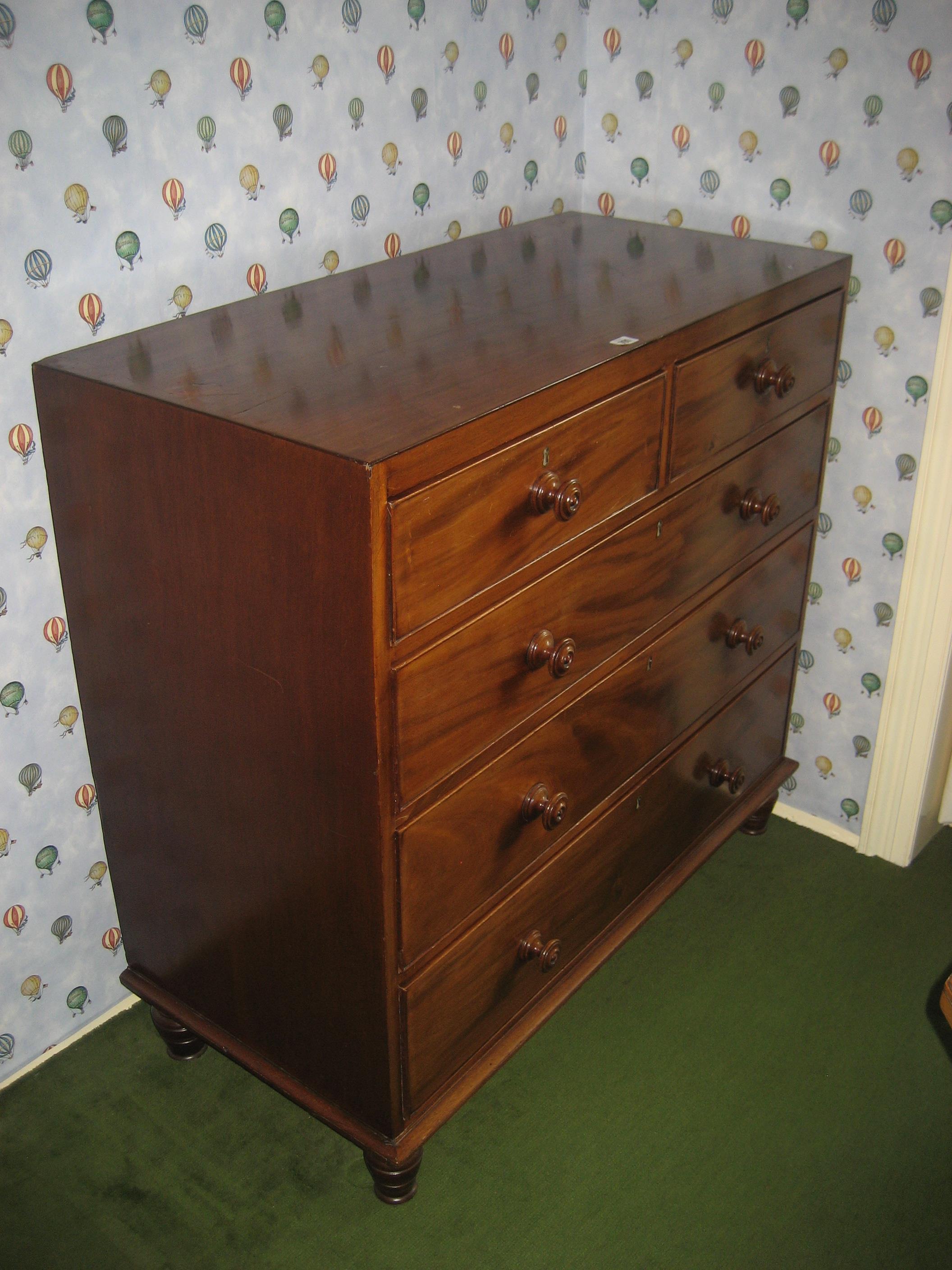 A late 19th century mahogany caddy top chest of drawers.