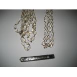 A silver cased pencil with chased decoration together with two modern 'moonstone type' necklaces (