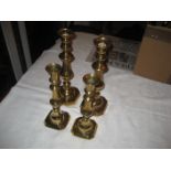 A collection of 19th century brass candlesticks