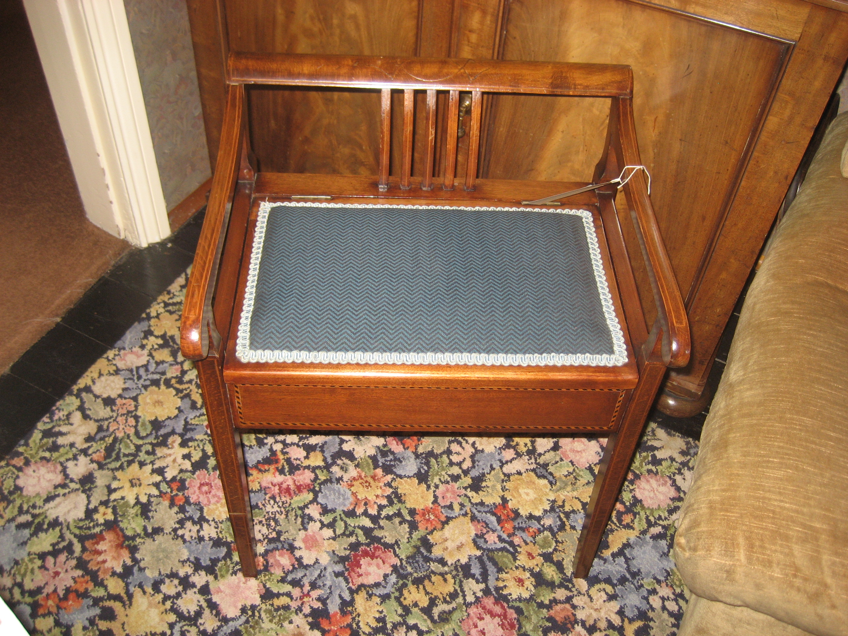 An early 20th century mahogany piano stool.