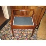 An early 20th century mahogany piano stool.