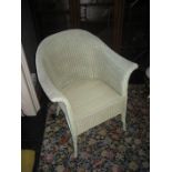 A Lloyd Loom basket chair.