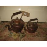 A 19th century copper kettle together with another (2).