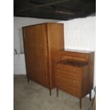 An Alfred Cox mid 20th bedroom suite comprising two bedroom chests, a wardrobe, a dressing table and