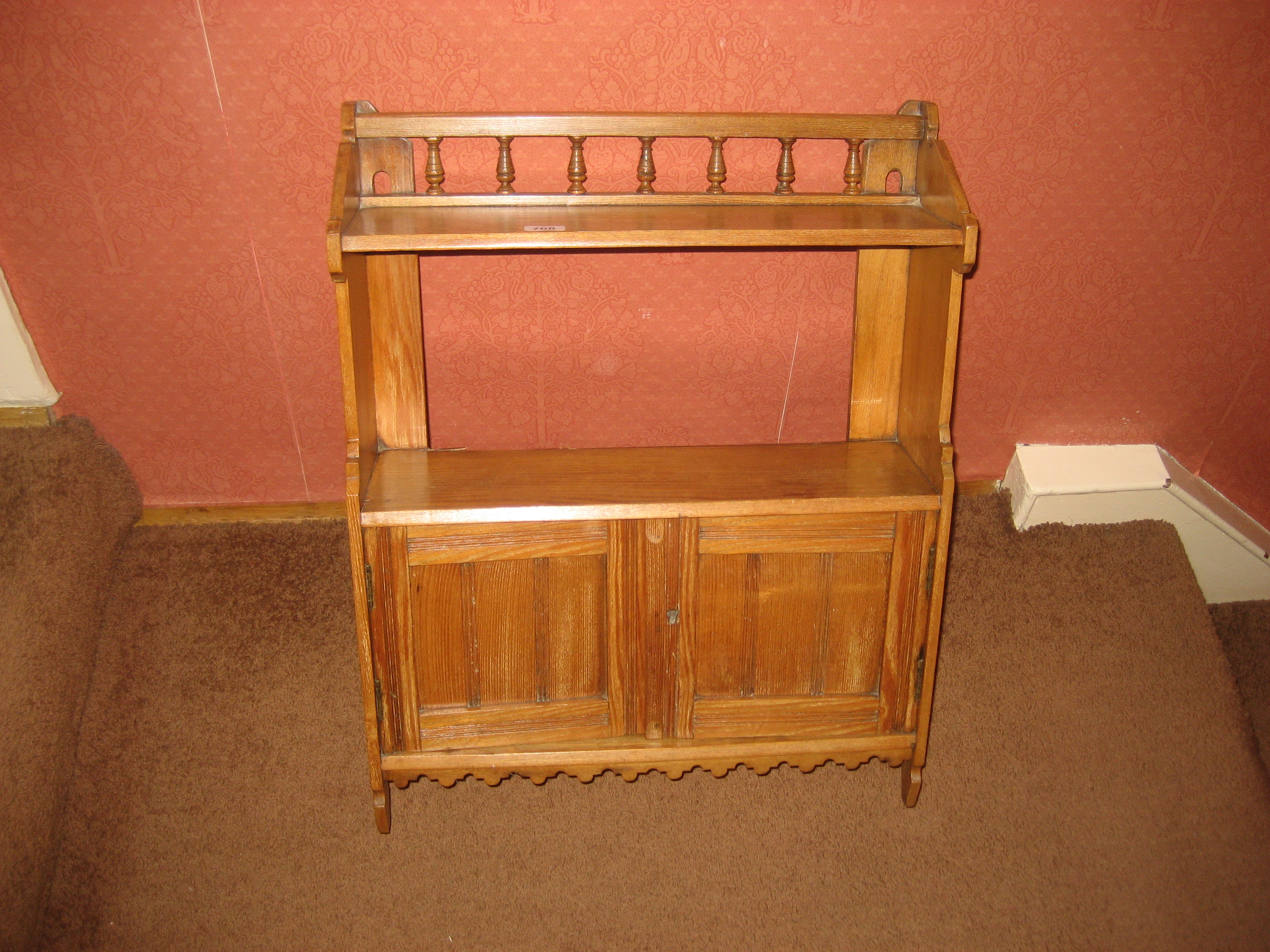 A pine wall shelf.