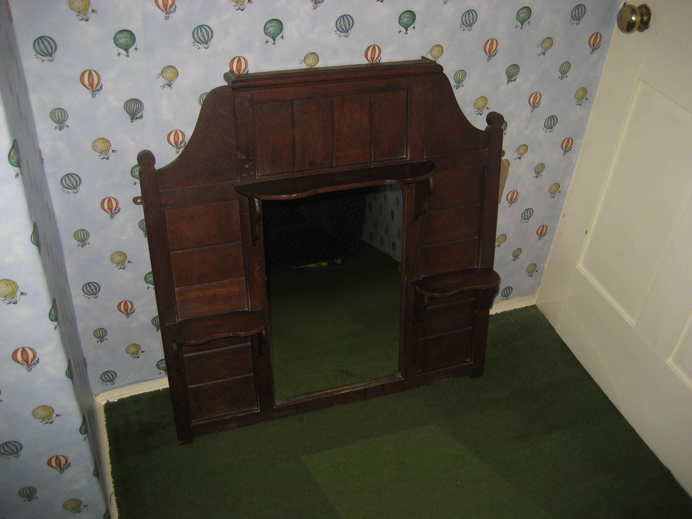 An oak over mantle mirror.