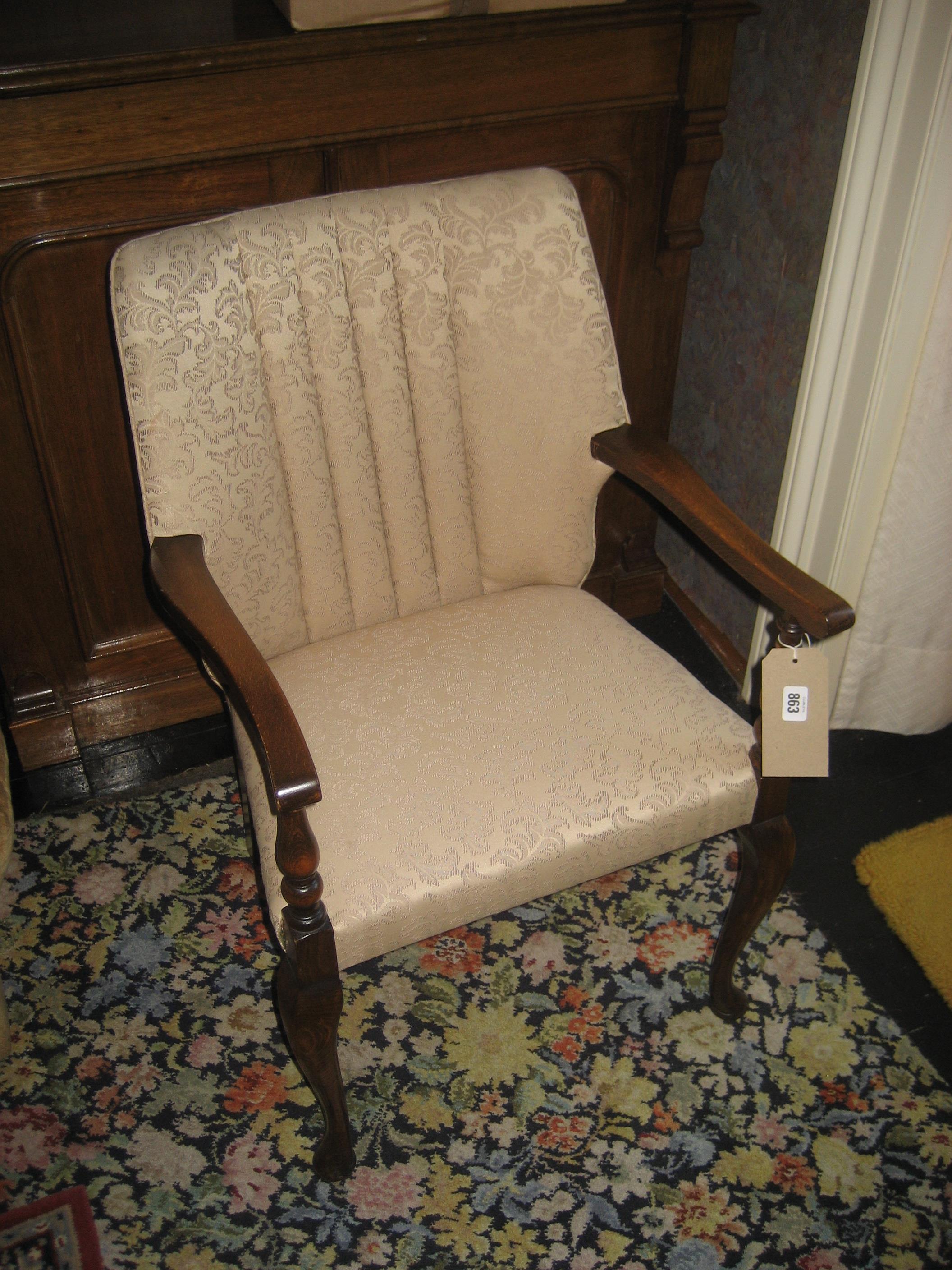 A 20th century Queen Anne type upholstered chair.