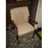 A 20th century Queen Anne type upholstered chair.