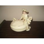 An R.H early 20th century porcelain posy basket with a gentleman reclining