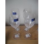 Four Villeroy and Boch wine glasses.