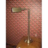 A brass reading lamp.