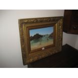 A gilt frame oil on board of a seascape