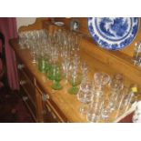 A collection of glassware to include 22 x sherry/ shot glasses, 6 x large pedestal glasses, 13 x