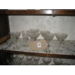 A collection of engraved and etched glassware.
