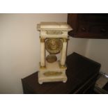 A late 19th century alabaster Portobello clock with central swinging pendulum
