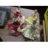 A collection of four Royal Doulton figures.