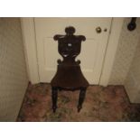 A 19th century mahogany hall chair.