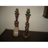 A pair of 20th century papier mache candlesticks