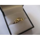 An 18ct single diamond serpent ring 2.9g all in.
